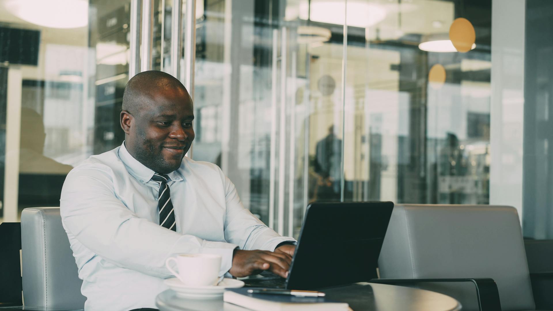 Home | Media Centre 1 business man on laptop