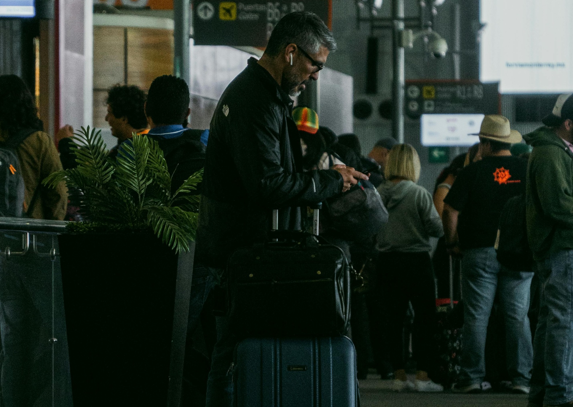 Home | Media Centre 1 man in airport with luggage