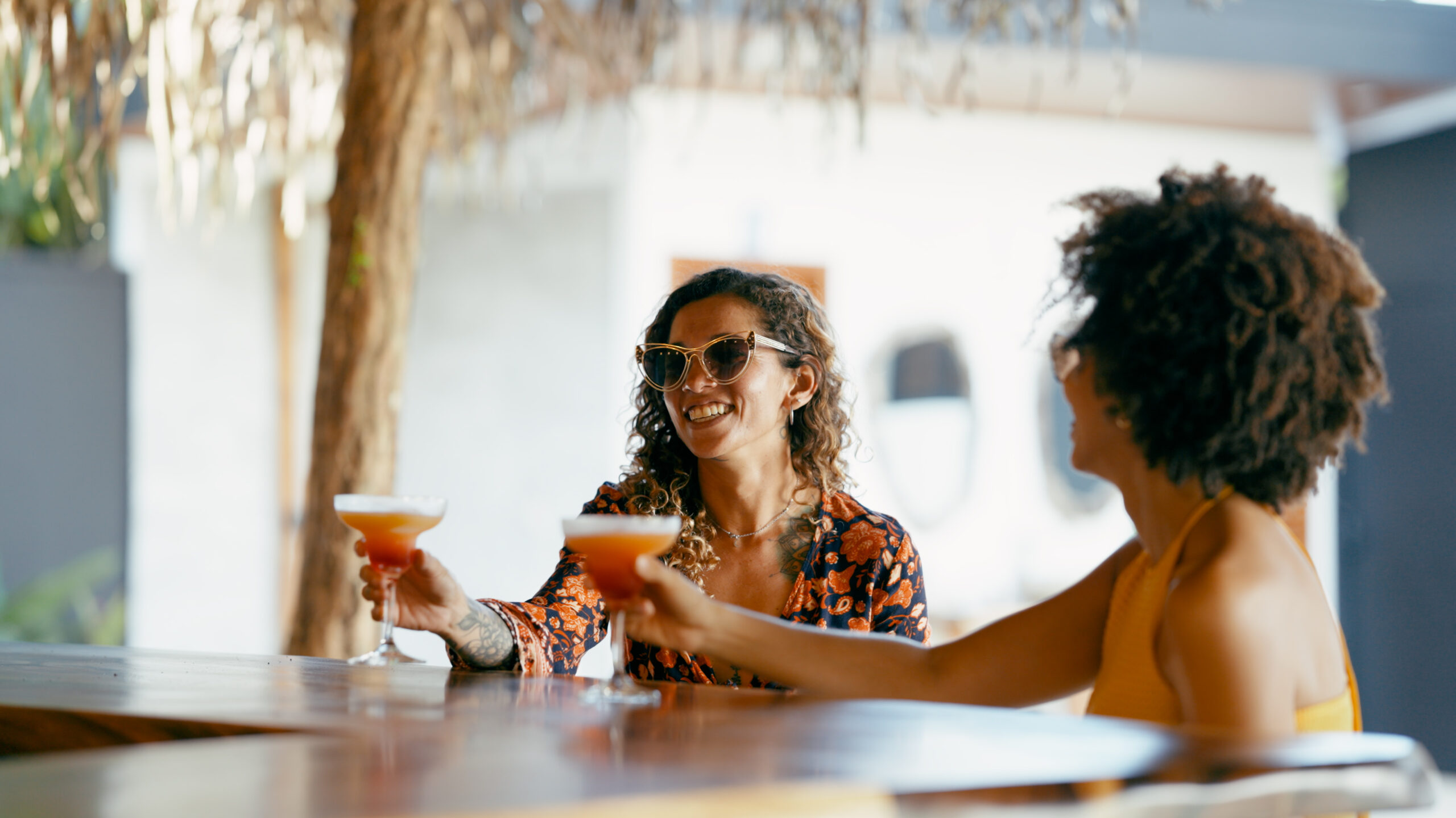 women enjoying cocktails at an outdoor bar 2026 06 23 04 08 29 utc scaled